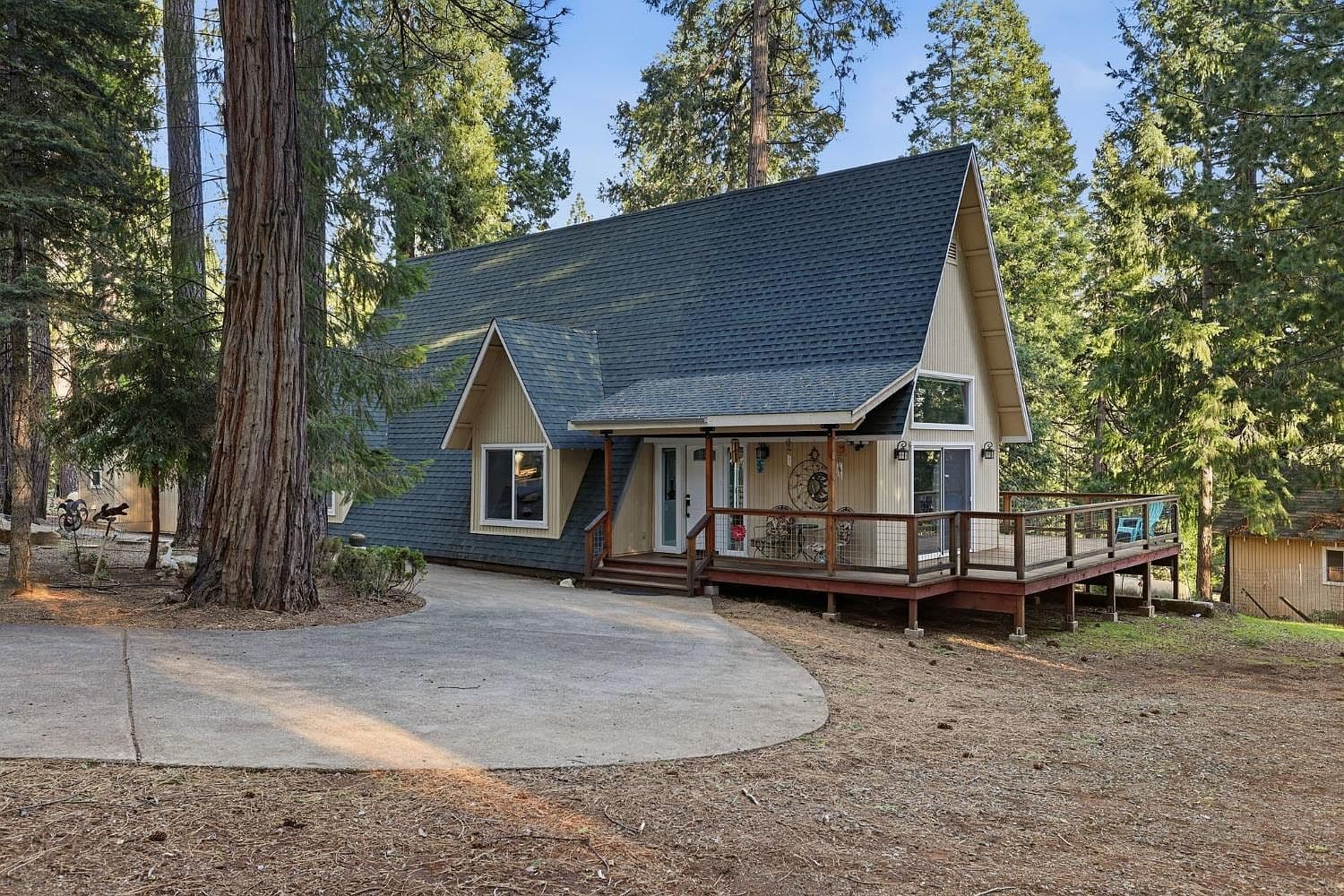 The main house at Saltwater Grove, an A-frame among towering Sierra pines