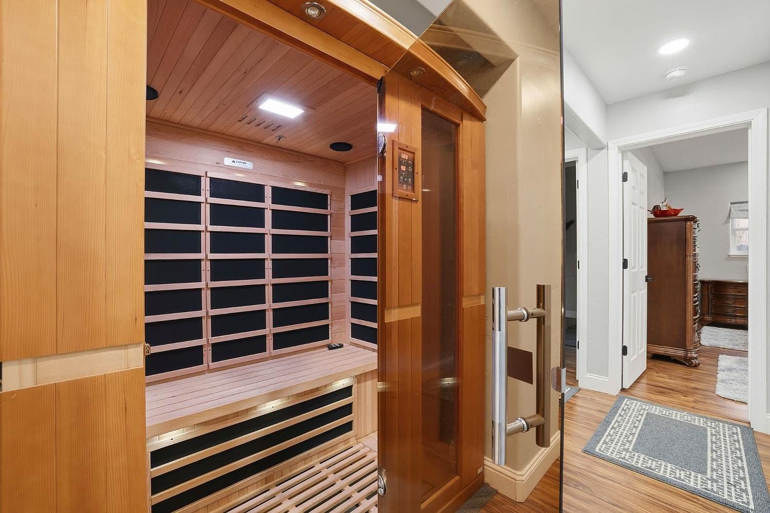 The intimate infrared sauna, lit warmly